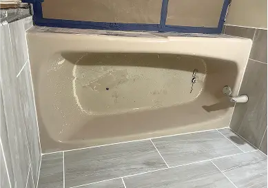 Bathtub before reglazing with visible chips and dullness