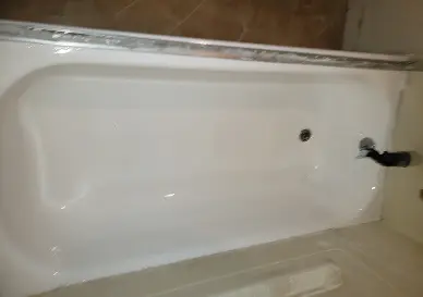 Fully restored bathtub after reglazing with clean and polished look