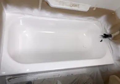 Refinished bathtub with bright white finish and restored shine