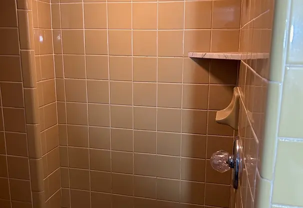 Before tile refinishing showing restored shine and smooth surface