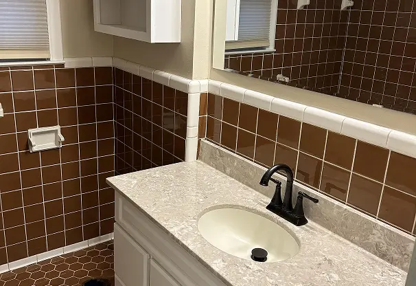 Before comparison of sink reglazing showing flawless transformation